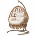 Silla colgante 105x105x195 cm de fibra trenzada beige con soporte para interior estilo bohemio